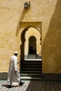 A man walks through the Mausoleum of Moulay Ismail in Meknes, Morocco.