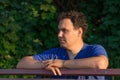 Man walks in the Park, admiring the vivid greens and bas Royalty Free Stock Photo