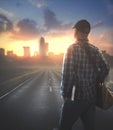 Man walking to city with Bible Royalty Free Stock Photo