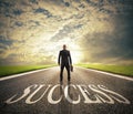 Man walks on a success way. Concept of successful businessman and company startup Royalty Free Stock Photo