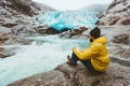 Man wanderer relaxing alone traveling at Nigardsbreen glacier in Norway Royalty Free Stock Photo