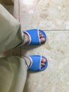 Man ware blue House slippers Royalty Free Stock Photo