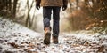 Man in warm felt boots and clothes stands on the trail , concept of Footwear