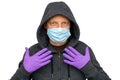 Man was defending himself and fighting the corona virus and other diseases by wearing gloves and hygiene mask.