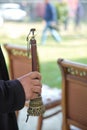 The man was holding a zurna in his hand . A man playing zurna traditional instrument in wedding