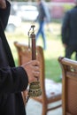 The man was holding a zurna in his hand . A man playing zurna traditional instrument in wedding