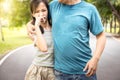 Man was hugging her daughter while her child girl can smell the armpit smelly or the body odor foul from her father with closing Royalty Free Stock Photo