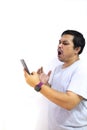 Man was making a frantic expression while looking at the mobile phone Royalty Free Stock Photo