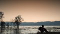 Man was sitting by the erhai lake