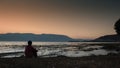 Man was sitting by the erhai lake