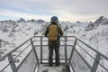 Man was standing at a viewing point in the Alps. A snowboarder stands against the background of the French Alps. Winter in french Royalty Free Stock Photo