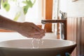 Man wash in clean tap water in home bathroom Royalty Free Stock Photo