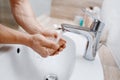 Man washes his face in bathroom, morning hygiene Royalty Free Stock Photo