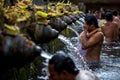 Man washes his face at Tirtha Empul