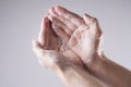 A man washes his hands with soap and water