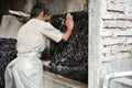 Man washing Batik traditional fabric of Indonesia