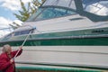 Man washing boat with brush Royalty Free Stock Photo