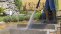 Man Washing Concrete Path With Pressure Washer Royalty Free Stock Photo