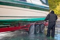 Man washing dirty boat Royalty Free Stock Photo