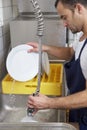 Man washing dishes Royalty Free Stock Photo
