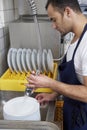 Man washing dishes Royalty Free Stock Photo