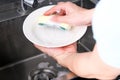 Man washing dishes and bowls in the sink And he uses sponges and foam to clean dirt and grease from food. Royalty Free Stock Photo