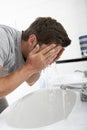 Man Washing Face In Bathroom Sink Royalty Free Stock Photo