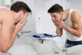 Man washing face in bathroom Royalty Free Stock Photo