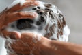 man washing hair with thickening shampoo