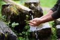 Man washing hands in fresh, cold, potable water Royalty Free Stock Photo