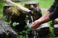 Man washing hands in fresh, cold, potable water