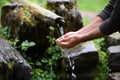 Man washing hands in fresh, cold, potable water Royalty Free Stock Photo