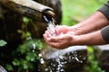 Man washing hands in fresh, cold, potable water