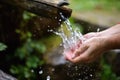 Man washing hands in fresh, cold, potable water Royalty Free Stock Photo