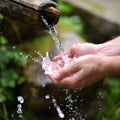 Man washing hands in fresh, cold water of mountain spri Royalty Free Stock Photo