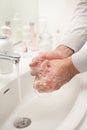 Man washing hands with soap at home. coronavirus prevention hand hygiene Royalty Free Stock Photo