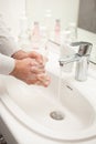 Man washing hands with soap at home. coronavirus prevention hand hygiene