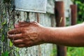 Man washing hands under an old washbasin outdoors at countryside Royalty Free Stock Photo