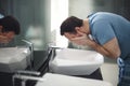 Man washing his face in bathroom Royalty Free Stock Photo