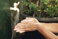 Man washing his hands with soap and running water Royalty Free Stock Photo