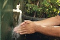 Man washing his hands with soap and running water Royalty Free Stock Photo