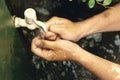 Man washing his hands with soap and running water Royalty Free Stock Photo