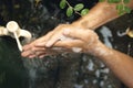 Man washing his hands with soap and running water Royalty Free Stock Photo