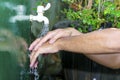 Man washing his hands with soap and running water Royalty Free Stock Photo