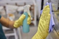 Man washing window in protective gloves closeup. Cleaning of apartments concept.