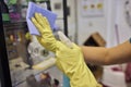 Man washing window in protective gloves closeup. Cleaning of apartments concept.