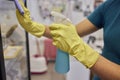 Man washing window in protective gloves closeup. Cleaning of apartments concept.