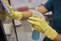 Man washing window in protective gloves closeup. Cleaning of apartments concept.