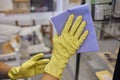 Man washing window in protective gloves closeup. Cleaning of apartments concept.