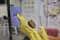 Man washing window in protective gloves closeup. Cleaning of apartments concept.